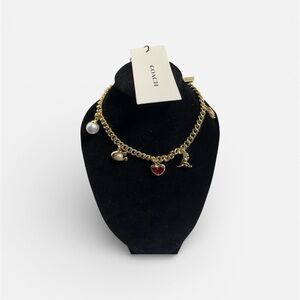 Coach Gold-Tone Multi-Charm Bracelet with a Rexy dinosaur - NWT ***